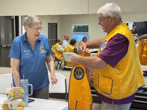 Lion Sharon receiving her Pride of Laguna Creek Vest 